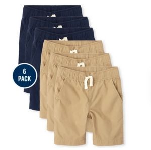 Boys pull on uniform shorts